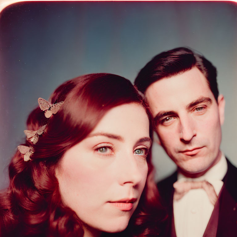 Vintage-style photo featuring woman with butterfly clips and man in suit.