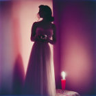 Vintage-dressed woman with candle and shadow holding object.