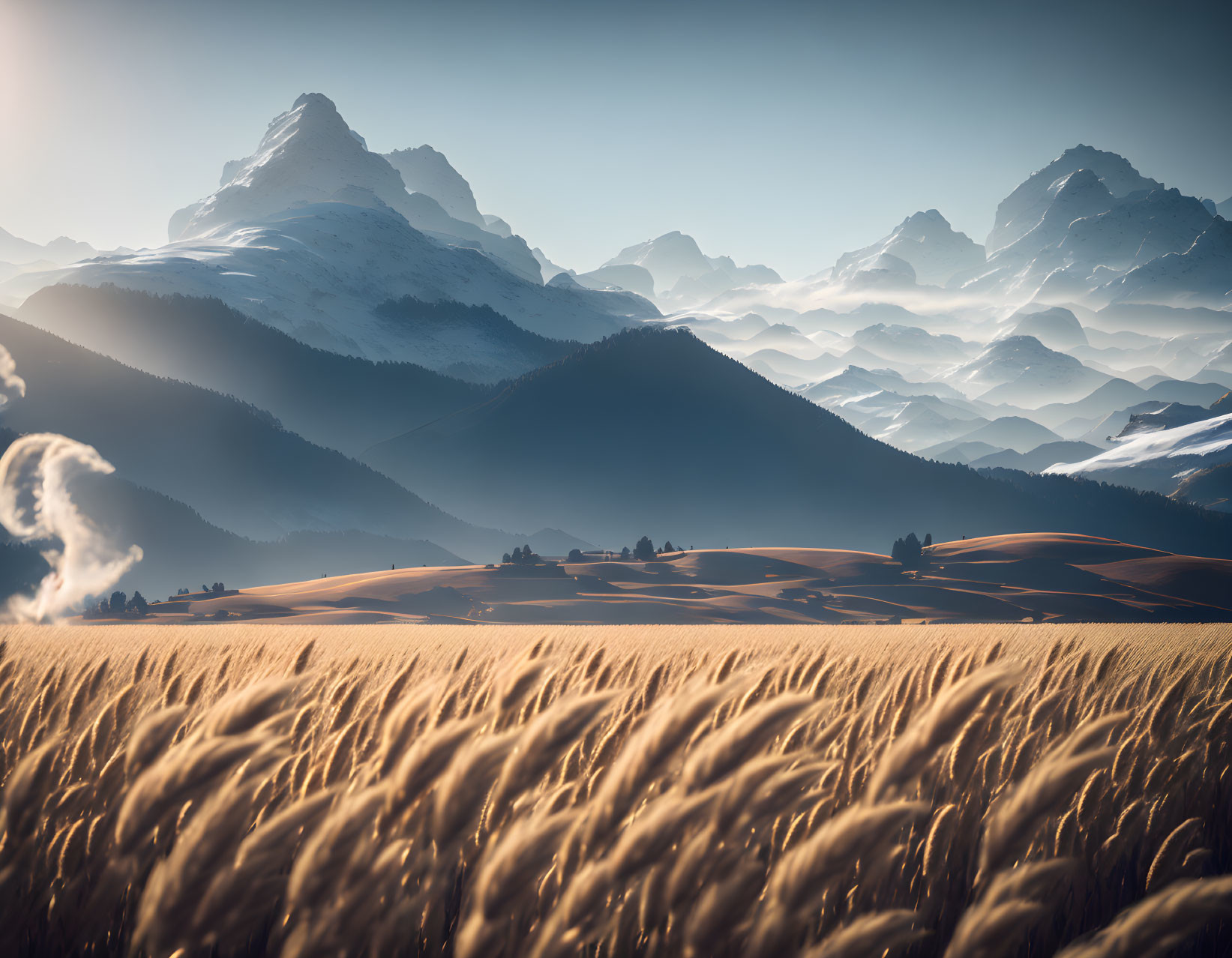 Golden Wheat Field and Layered Mountains Landscape Under Blue Sky