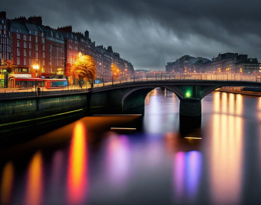 Twilight cityscape with illuminated buildings and bridge over calm river