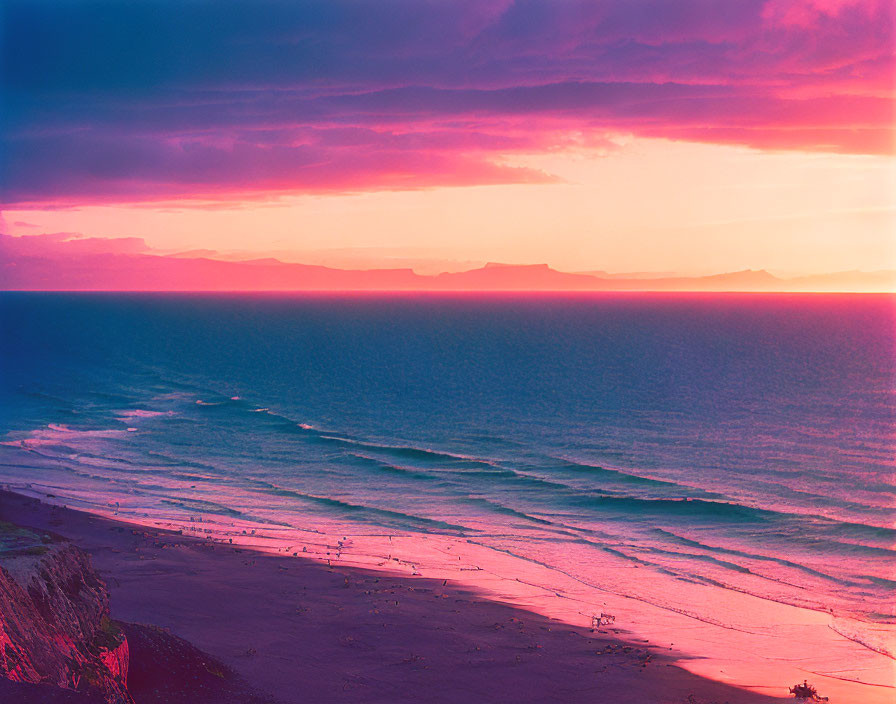 Scenic beach sunset with mountains and colorful sky