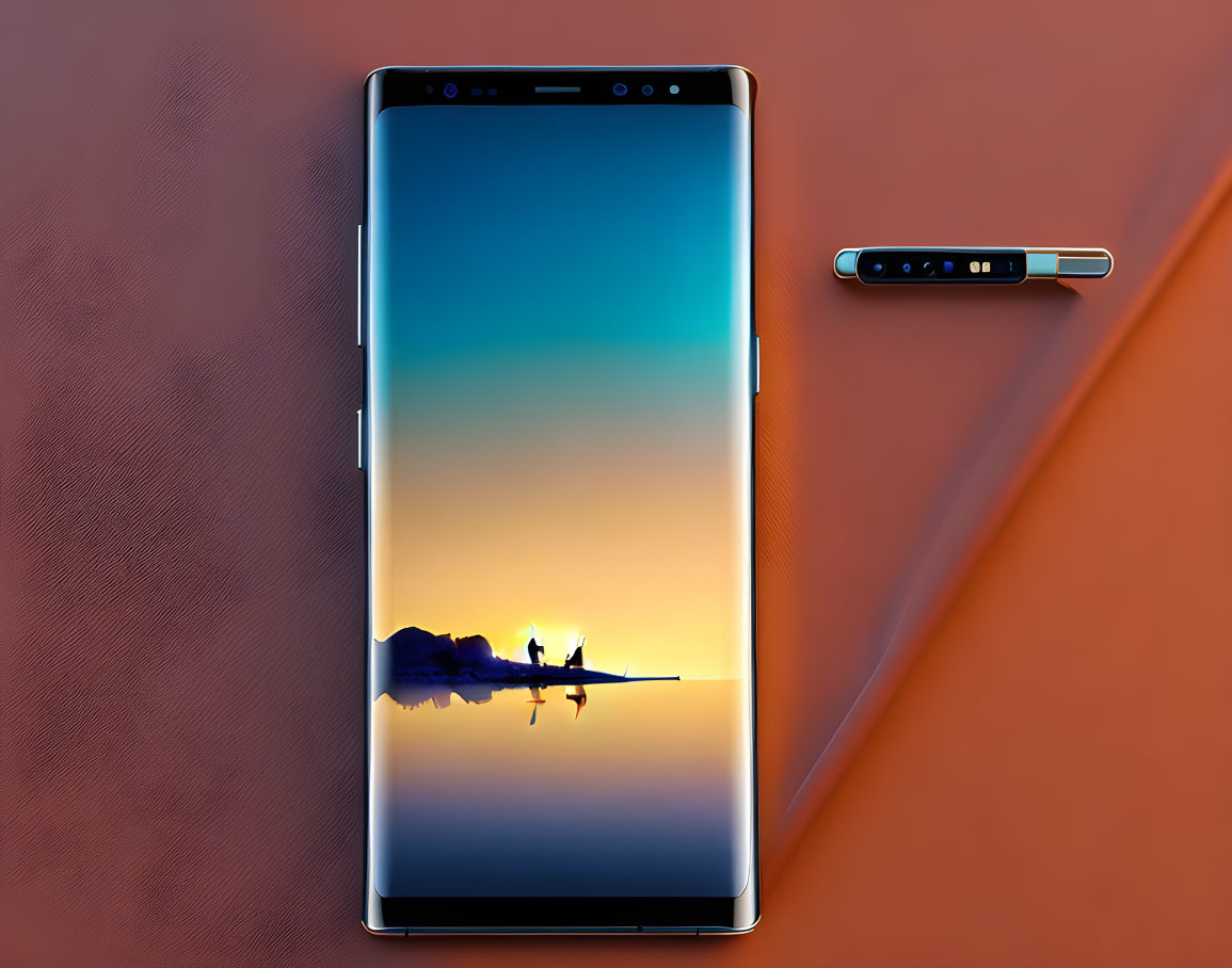 Smartphone with sunset wallpaper and stylus pen on brown background