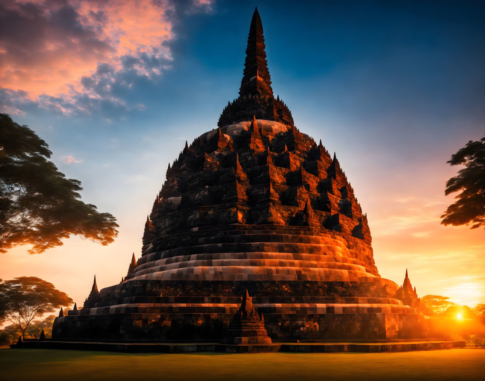 Ancient temple at sunset with orange and blue skies