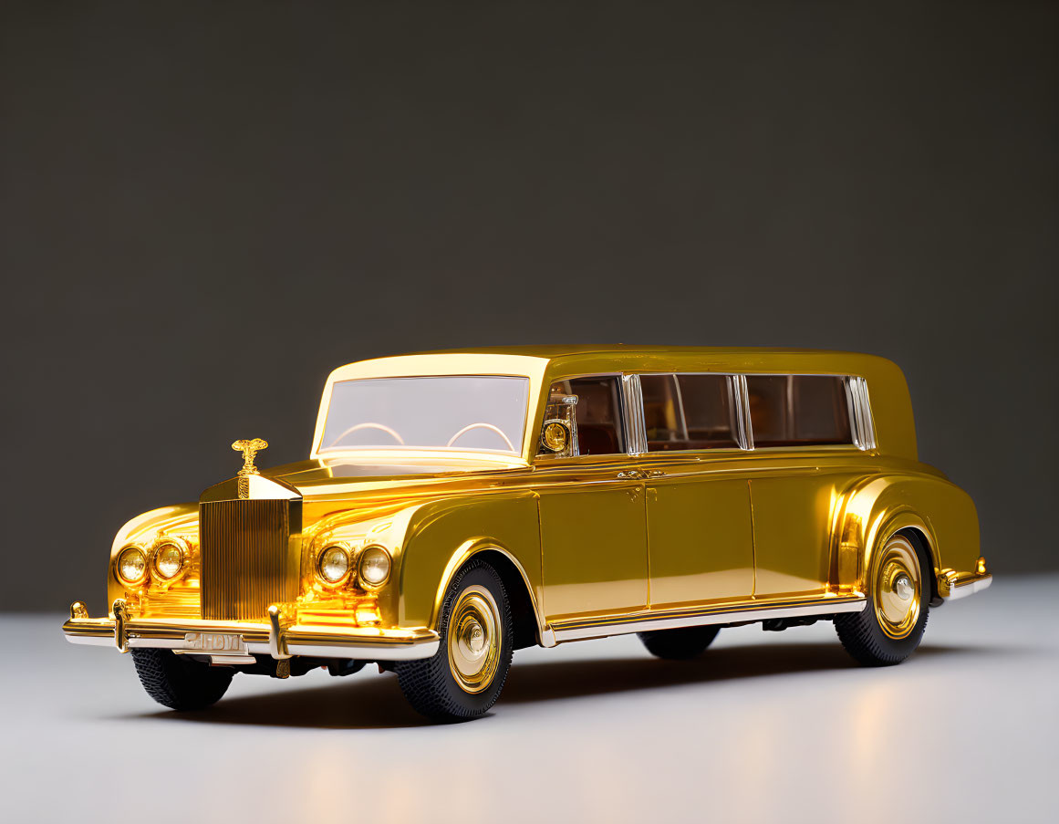 Golden Limousine Model with Classic Design and Prominent Grille on Gray Background