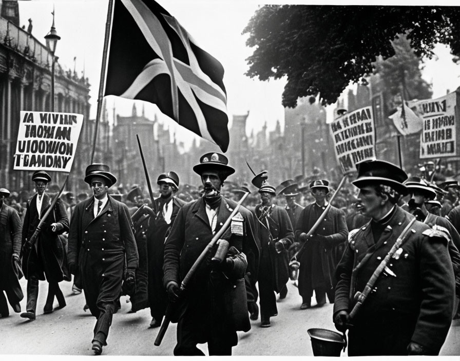 Historical protest photo: men in suits with flags marching in street