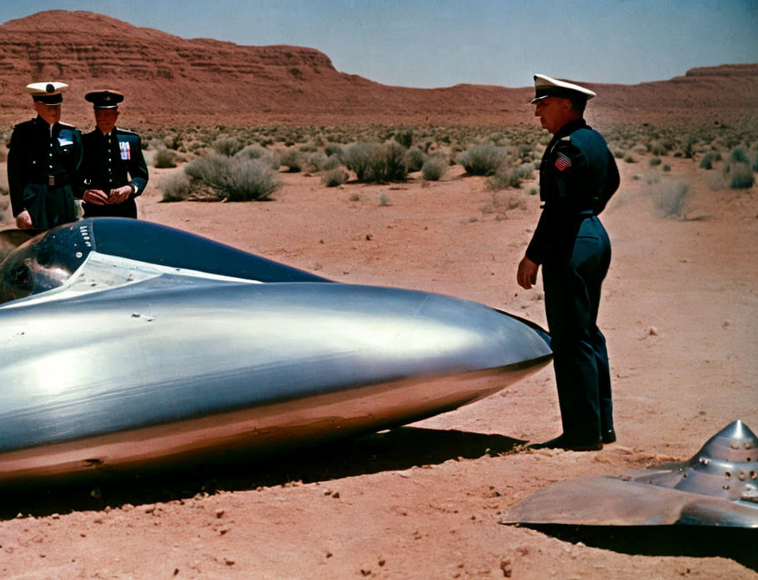 Three military officers with futuristic aircraft in desert landscape