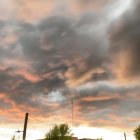 Massive Cumulonimbus Cloud with Tornado at Sunset