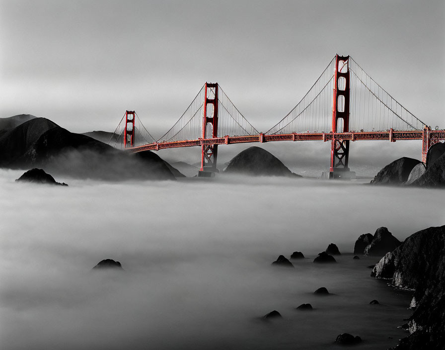 Monochrome Golden Gate Bridge photo with red accents in foggy setting