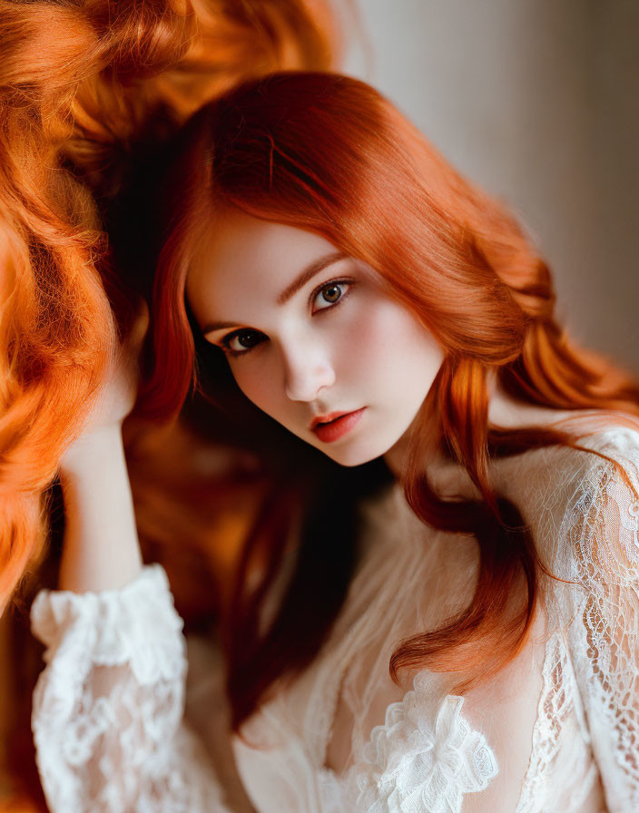 Red-haired woman in white lace under soft light