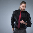 Stylish male figure with slicked-back hair and edgy attire