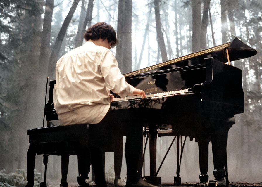 Person playing grand piano in misty forest creates magical ambiance