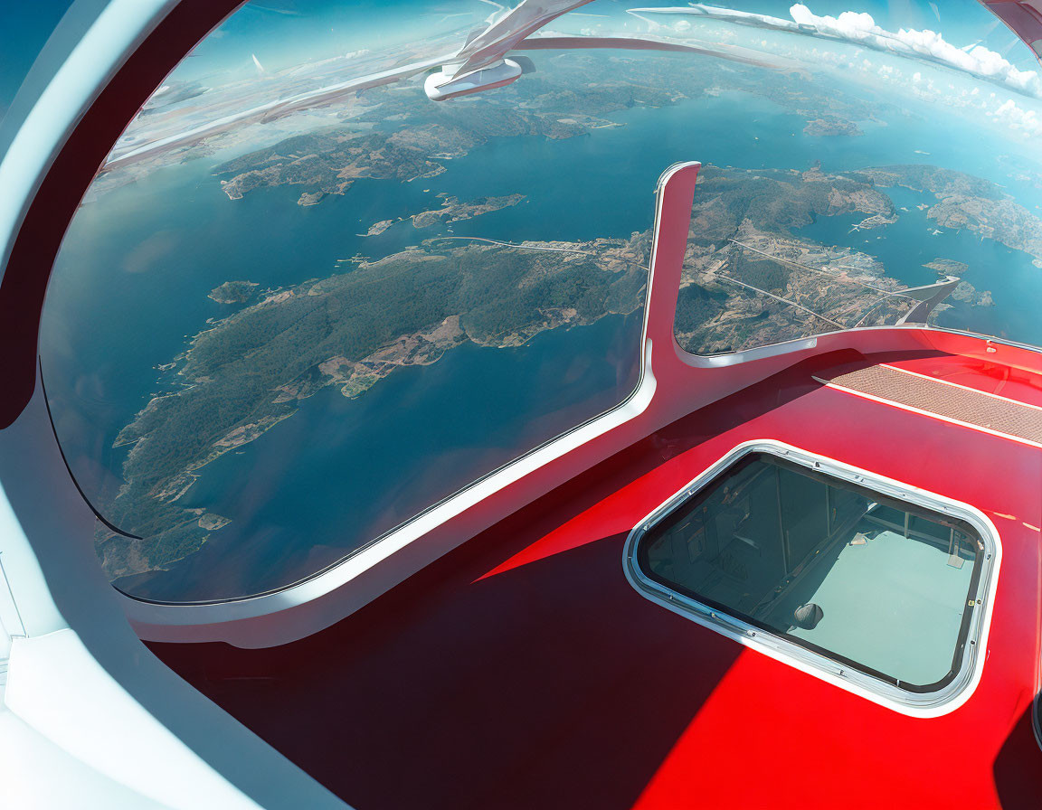 Airplane Wing Over Clear Skies and Green Coastline