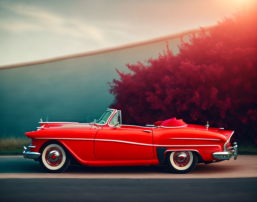 Vintage Red Convertible Car Parked Under Sunset Sky