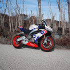 Sporty Motorcycle with Red and White Accents on Desert Road