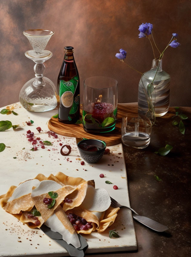 Sophisticated still-life with crepes, berries, flowers, and glassware