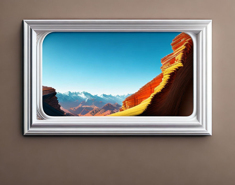 Vibrant canyon with red rocks and snow-capped mountains in a framed picture