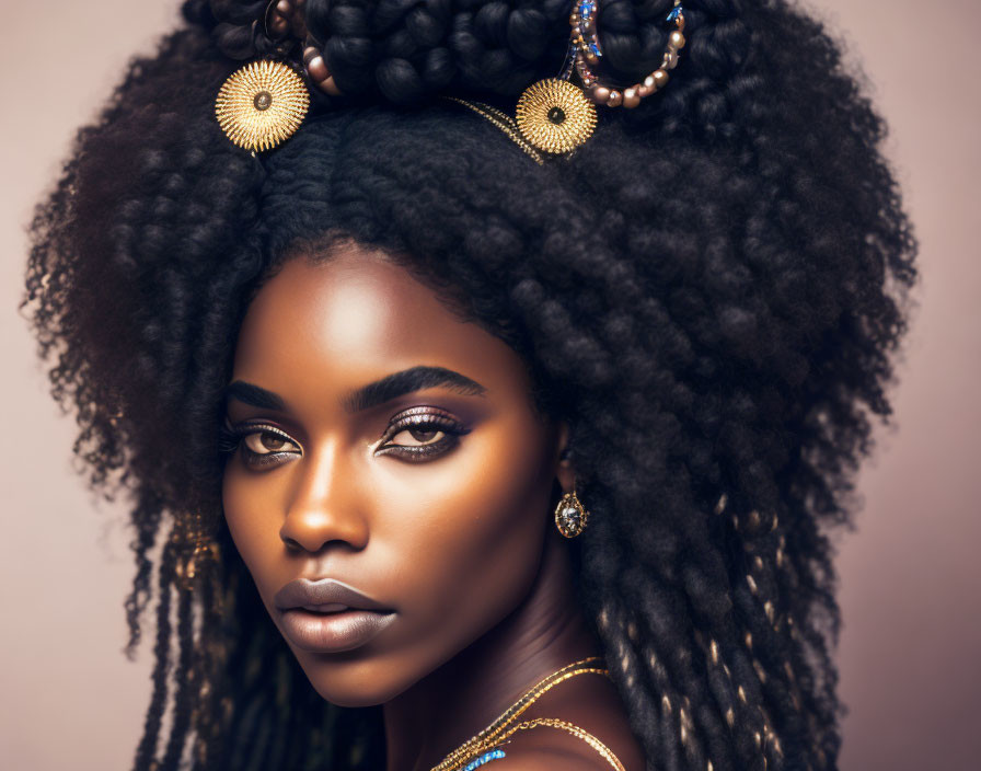 Woman with Voluminous Black Hair and Golden Accessories Displays Striking Makeup and Elegant Jewelry