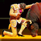 Traditional bullfighting performance with matador and bull in a bullring