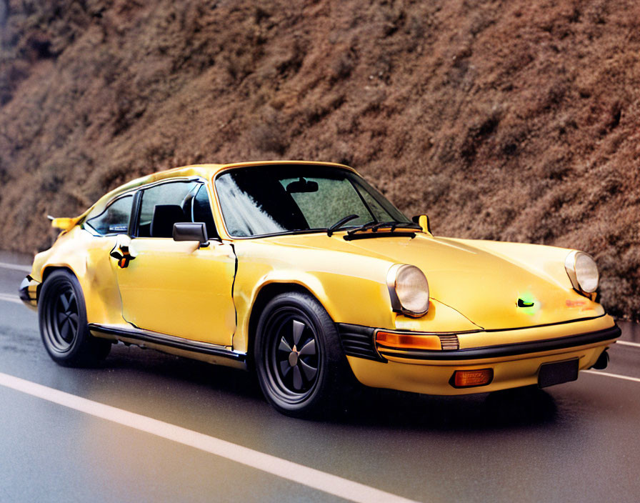 Yellow Porsche 911 Sports Car Parked on Asphalt Road