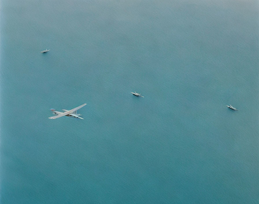 Aerial View of Large Body of Water with Four Boats