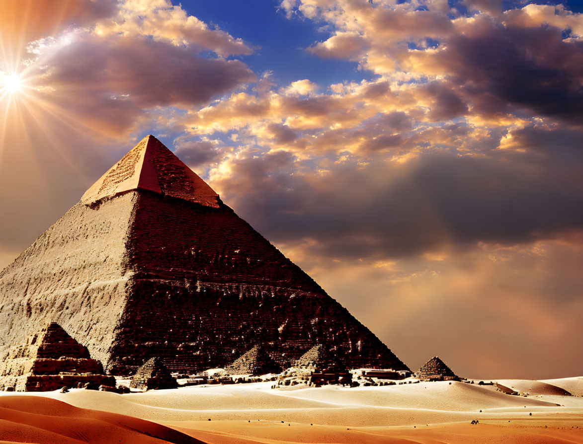 Great Pyramid of Giza with sunburst in clear blue sky