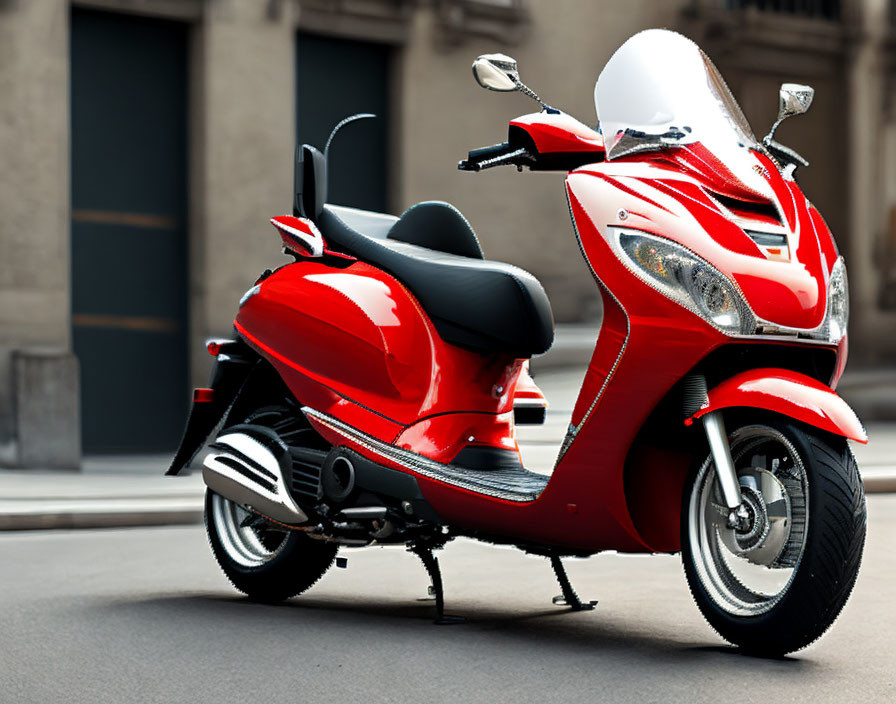 Vibrant red scooter on urban road with sleek design