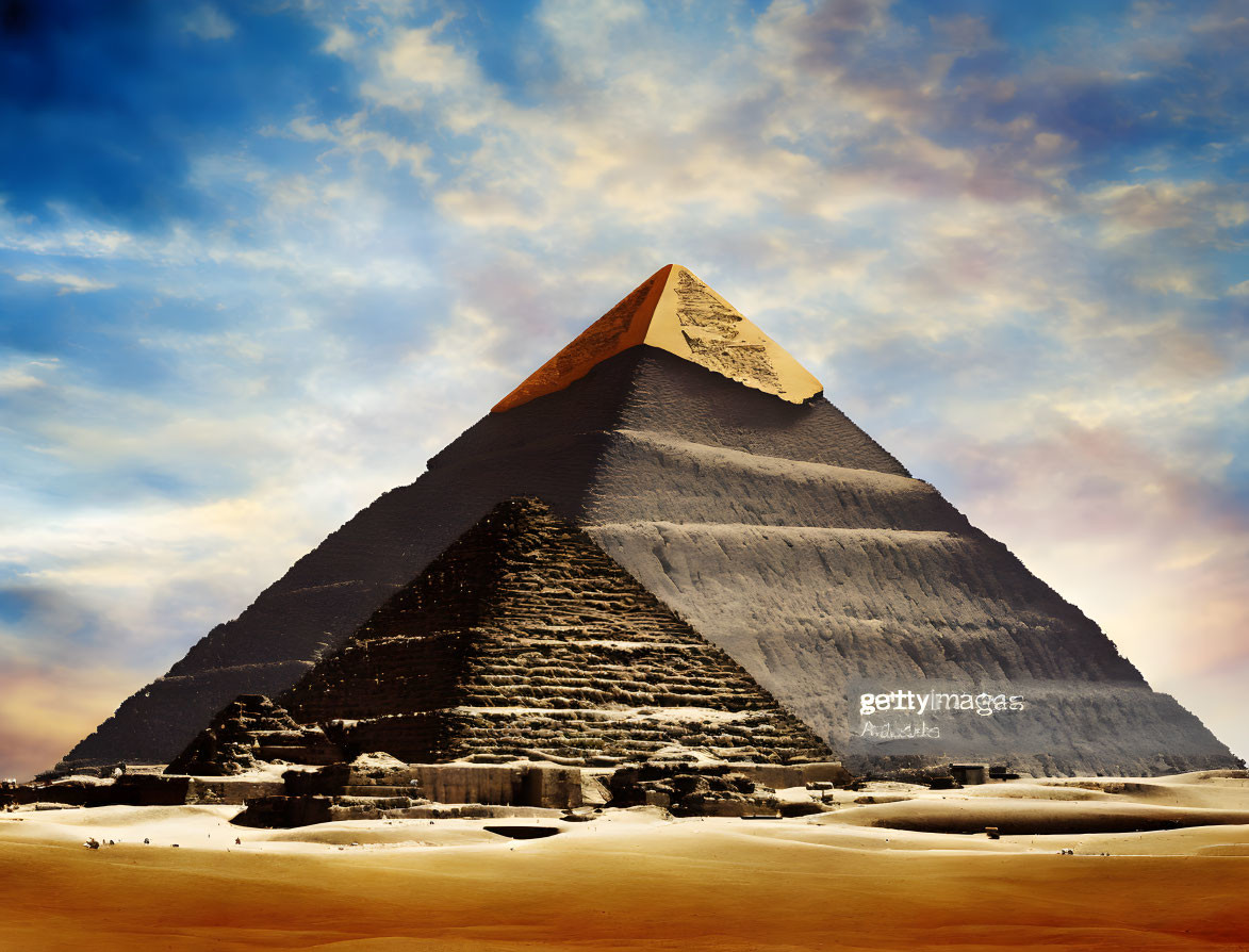 Majestic pyramid under dramatic desert sky