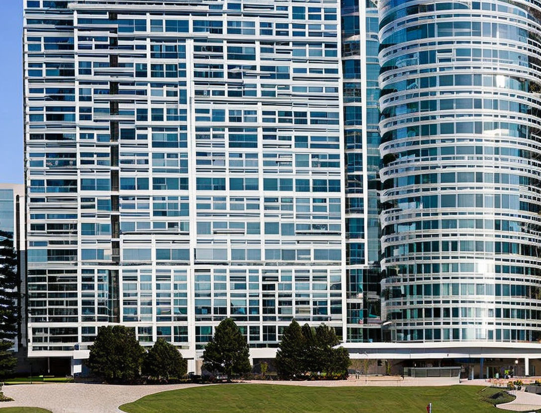 Glass facade high-rise buildings with park area at base