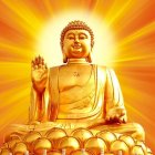 Golden Buddha Statue Seated in Lotus Position on Orange Bokeh Background