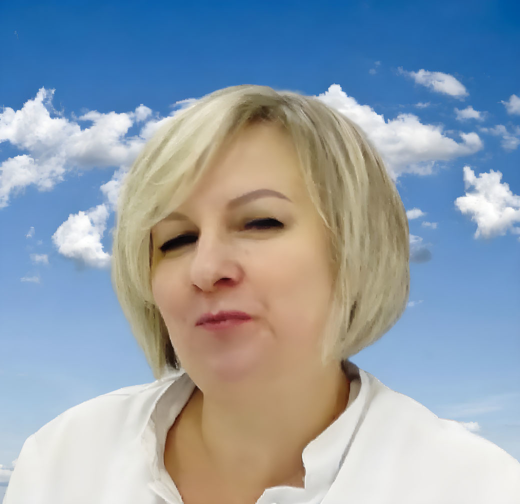 Blonde person in white shirt squinting against blue sky