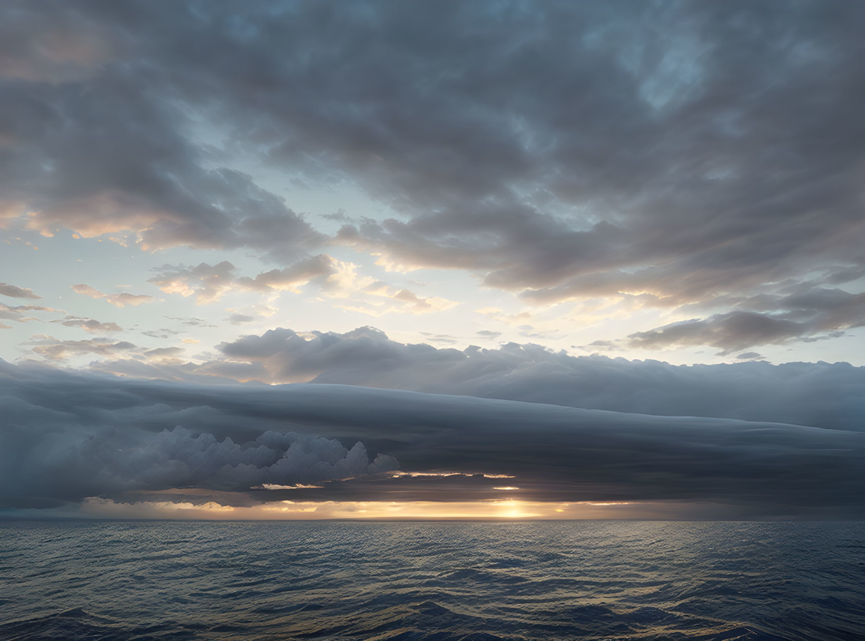 Tranquil sunset over the ocean with golden sky