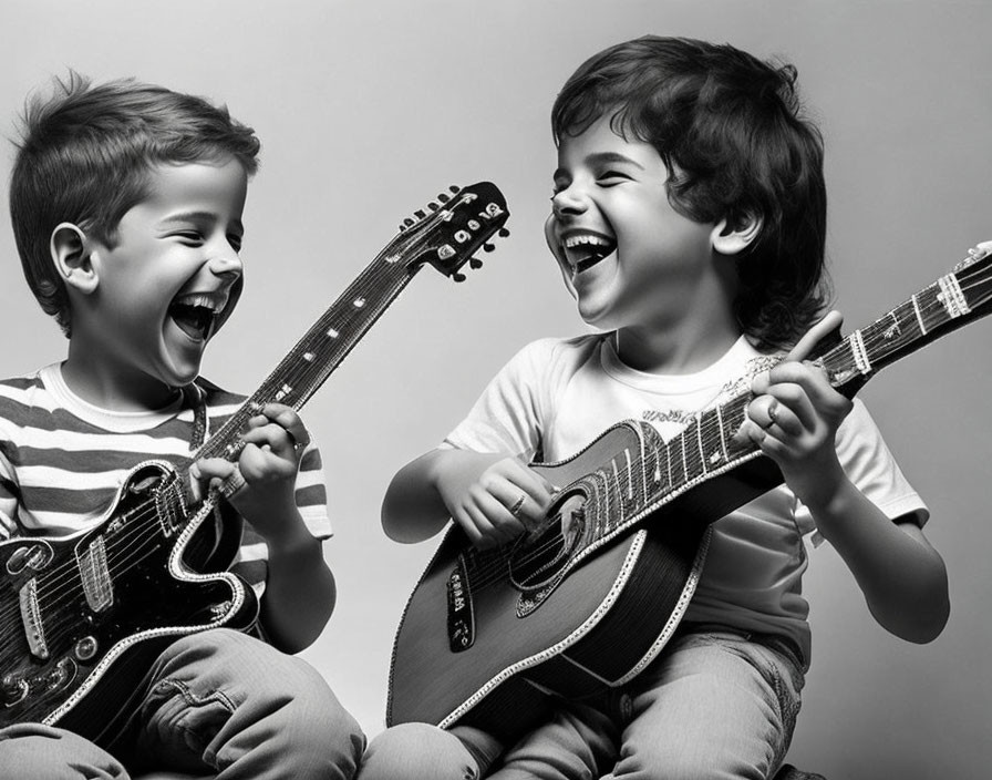 Happy children with guitars in black and white photo