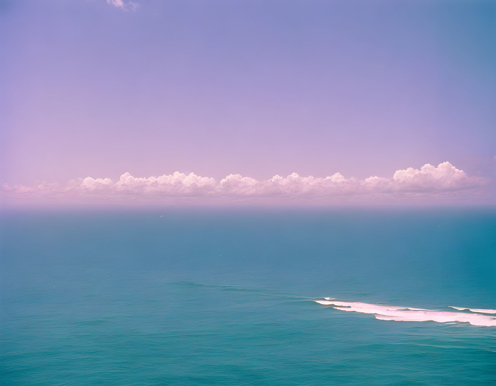 Tranquil Seascape with Blue Waters and Pastel Sky