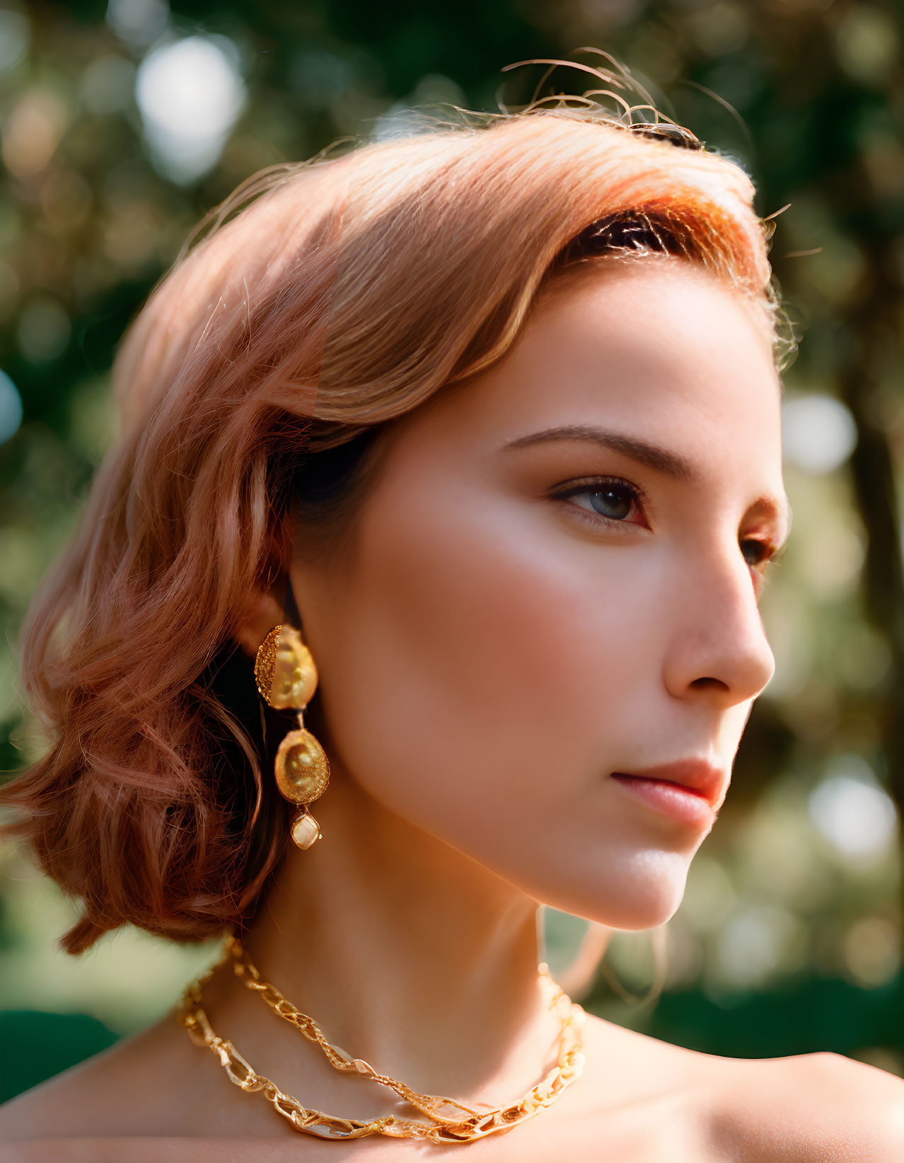 Woman with Short Wavy Hair in Gold Jewelry on Green Background