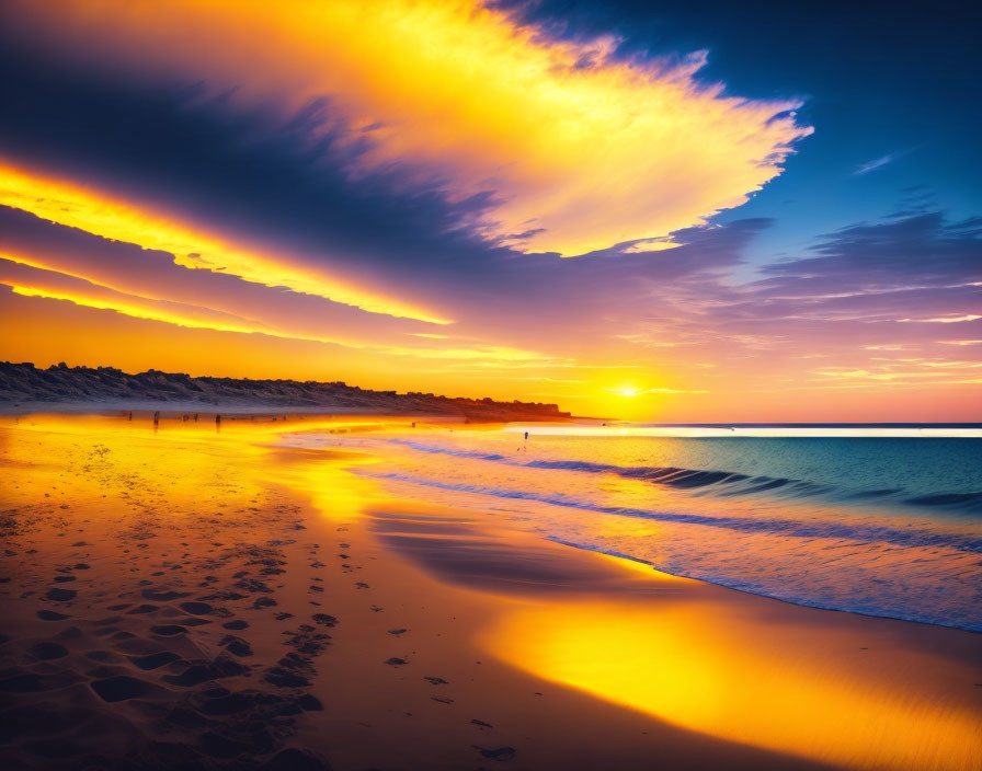 Scenic beach sunset with fiery clouds reflected on water and wet sand