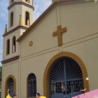 Vibrant illustration of people in yellow garb approaching church