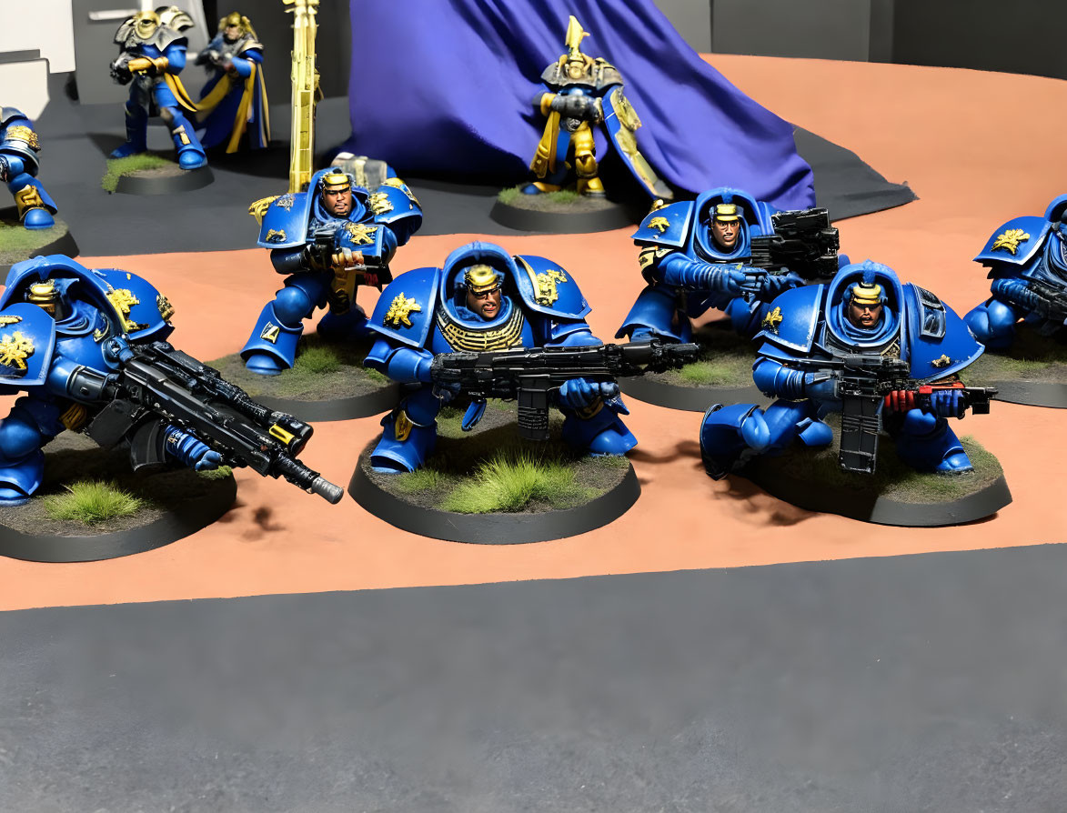 Blue and Gold Warhammer 40k Space Marine Figurines on Grey Diorama