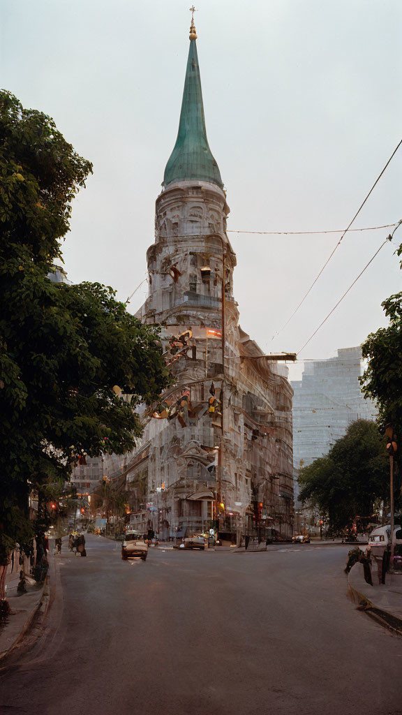 Renovation of old building with pointed tower in soft evening light