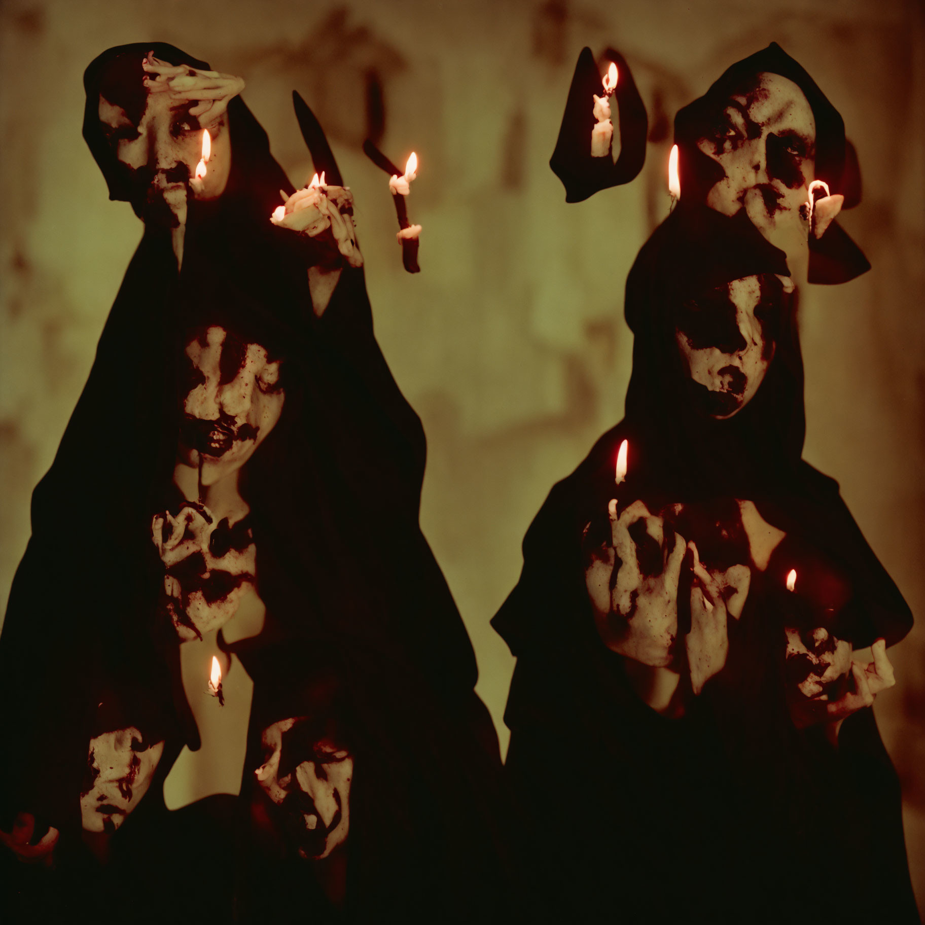 Mysterious cloaked figures with skull-like makeup and candles