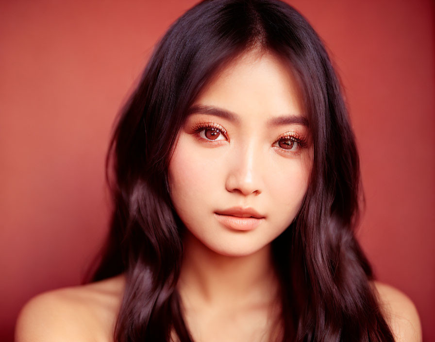 Close-Up Portrait of Woman with Long Dark Hair and Large Eyes