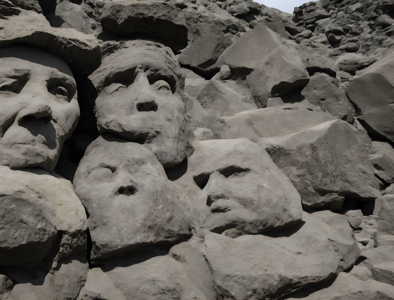 Rocky Texture Wall with Carved Human Faces