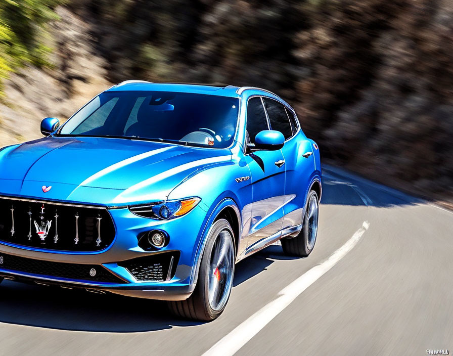 Blue Maserati Levante SUV Speeding on Sunlit Road with Motion Blur