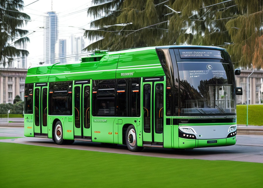 Green electric bus on road with trees and skyscraper.