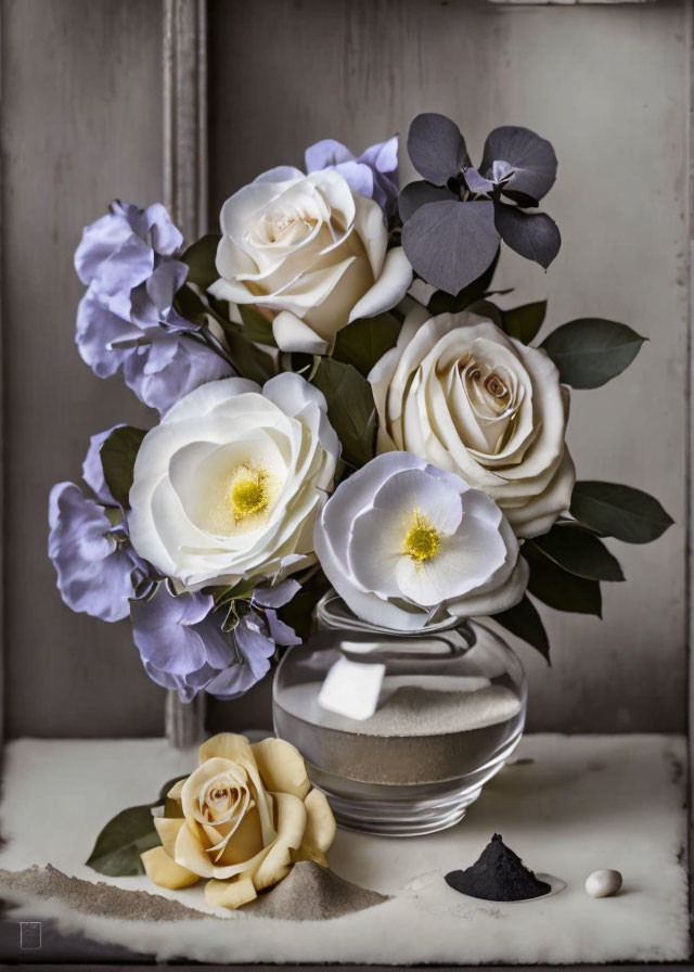 Creamy White Roses and Purple Flowers in Glass Vase on Rustic Surface