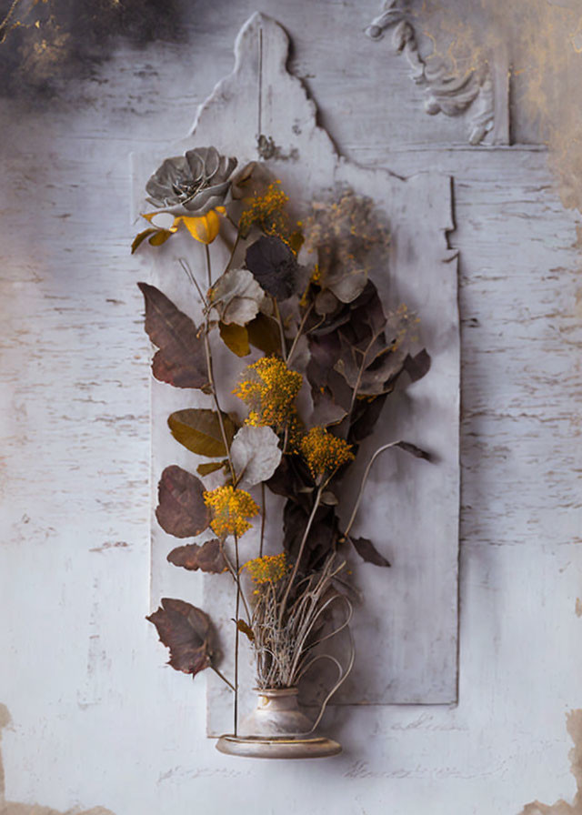 Dried Flowers and Leaves in Vase on Rustic White Wooden Background