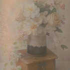 Pastel roses and white flowers in lace-wrapped vase on antique box