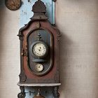 Vintage Wall Clock with Pendulum on Blue Wooden Background and Old Books