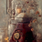 Rustic stove with vintage kettle, clock, dried flowers, and teacups