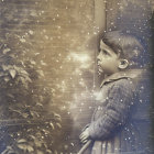 Vintage sepia-toned photo: Young child in period clothing outdoors