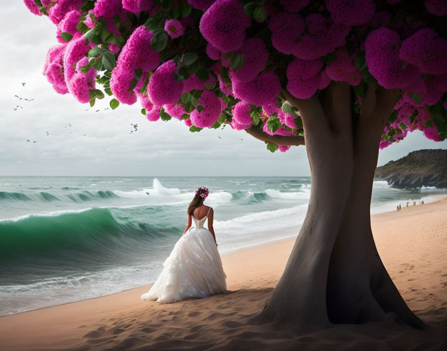 Bridal woman under pink blooming tree on beach with ocean view